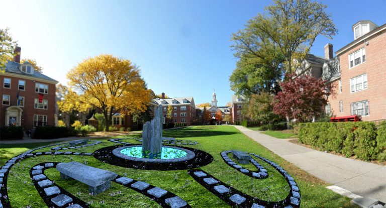 A speculative monument featuring winding gray stone pathways, a gray stone bench, and a series of long and tall gray stone columns protruding from the grass.