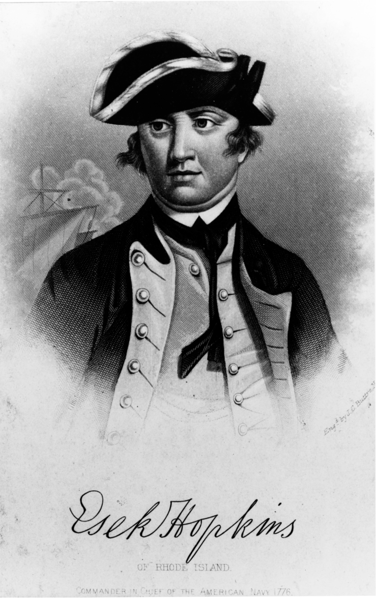 Black and white portrait of curly-haired man with a ship's mast in the background.
